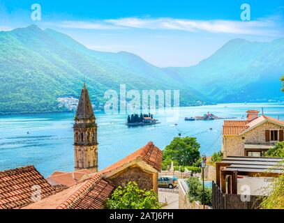 Belltower of St Nicholas church and famous islands in Perast, Montenegro Stock Photo