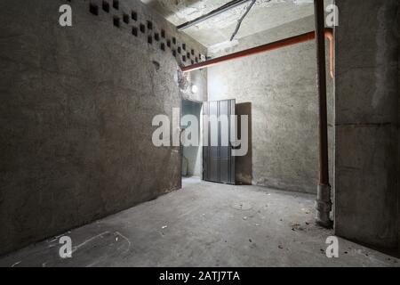 Empty basement interior with concrete walls Stock Photo