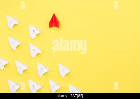 New ideas creativity and different innovative solution. Business concept. A group of paper airplanes, one plane is flying in the other direction, diff Stock Photo