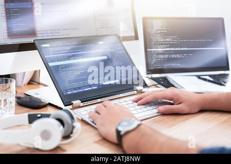 Developing programming and coding technologies. Website design. Programmer working in a software develop company office. Stock Photo
