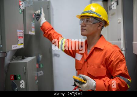 Electrician engineer working in the electricity building Stock Photo