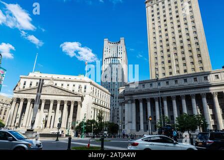 New York City, USA - August 2, 2018: Thurgood Marshall United States Courthouse and the New York State Supreme Court Building with people around in Fo Stock Photo