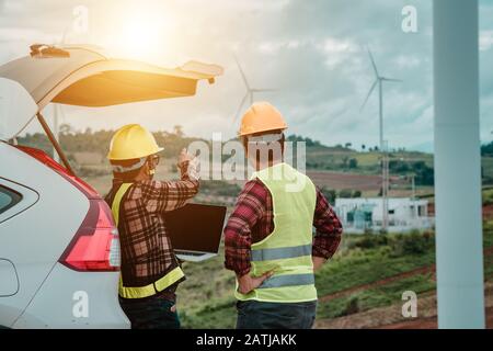 Engineering working together and planning about wind turbine electric Stock Photo