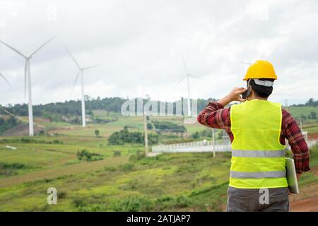 Engineering uses the mobile  report to the office Stock Photo