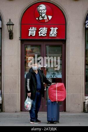 Beijing, China. 03rd Feb, 2020. A Chinese man wearing a protective face mask waits outside a KFC at a bus station in downtown Beijing on Monday, February 3, 2020. The coronavirus, according to health officials, now has surpassed the SARS crisis with over 360 dead and close to 17,000 Chinese infected. Starbucks, McDonald's, KFC and Pizza Hut have closed stores in China. Photo by Stephen Shaver/UPI Credit: UPI/Alamy Live News Stock Photo