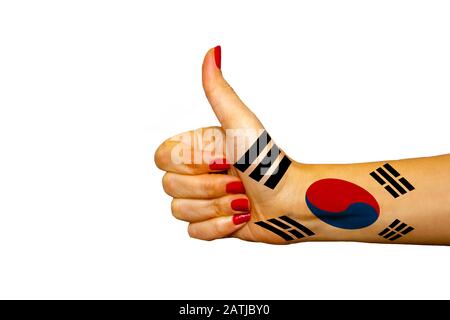 South Korea flag painted on hand showing thumbs up Stock Photo