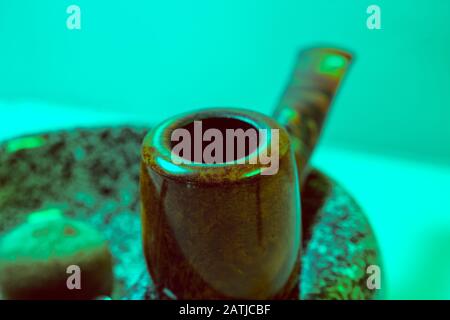 Macro picture red-brown pipe on an ashtray vintage Stock Photo