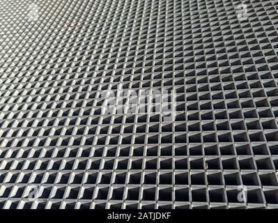 Closeup of the concrete backdrop with small square holes Stock Photo
