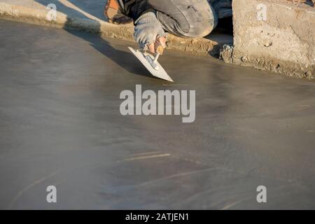 Plastering or pouring the floor with cement for construction Stock Photo