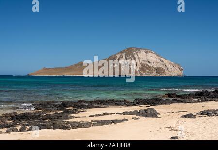 Rabbit island in the sea off Makapu'u beach in winter on the east coast of Oahu Stock Photo