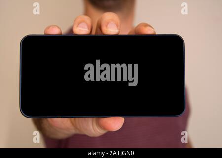 Man Showing His Mobile Smart Phone Stock Photo