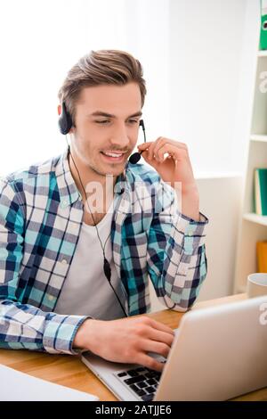 Portrait of man in headphones working in call center Stock Photo