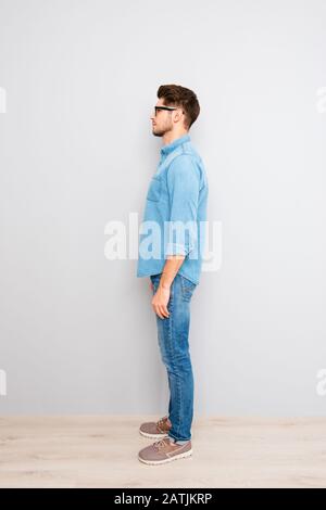 Side view of young trendy handsome man in glasses Stock Photo