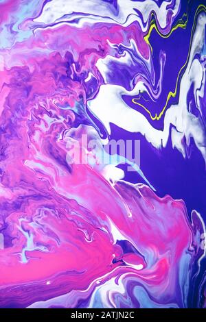 Acrylic paint liquid in trend purple and blue color mix background. Stock Photo