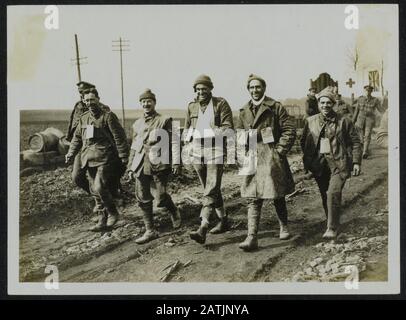 The British Western Front in France. The German offensive Description: The Spirit of our Army. Keep smiling Carry on! Wounded just arrived from the fighting line leaving the Casualty Clearing Station. Annotation: The British Western Front in France. The German offensive. The spirit of our army. Keep smiling and go on! Wounded soldiers are just leaving the front generated a first aid station. Date: {1914-1918} Location: France Keywords: WWI, fronts, wounded soldiers, related items Stock Photo