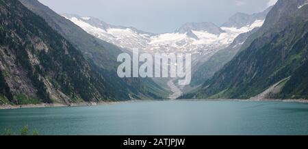 Stunning panoramic landscape image of Schlegeis lake and glacier in Tirol, Austria Stock Photo