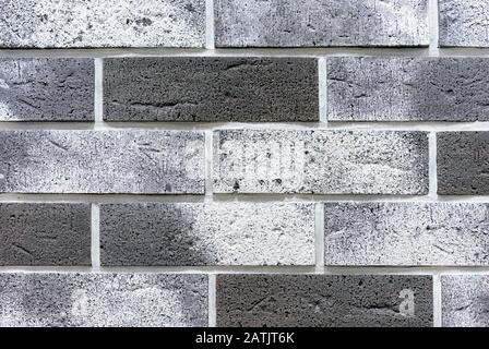 Brick wall from of gray and white bricks. Background and texture of brickwork. Stock Photo