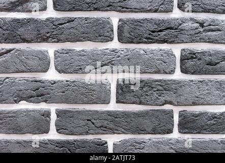 Brick wall from of gray and white bricks. Background and texture of brickwork. Stock Photo