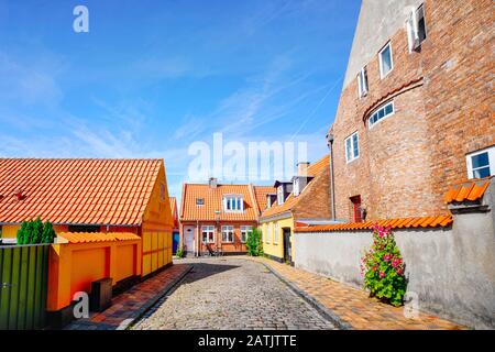 Colorful danish street in the summer with small houses under a blue sky Stock Photo