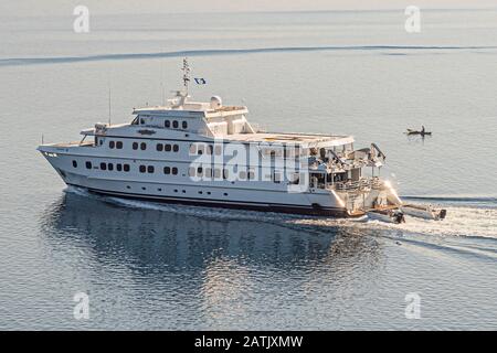 The flag of Bougainville flies at the mast of the Australian mega yacht True North, underway in the waters of Papua New Guinea. Weeks earlier, Bougainville's population had voted 98 percent in favour of independence from Papua New Guinea in a referendum. Stock Photo