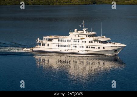 The Australian mega yacht True North is seen from the air shortly after the onboard helicopter took off, cruising through the waters off Bougainville, Papua New Guinea. Stock Photo