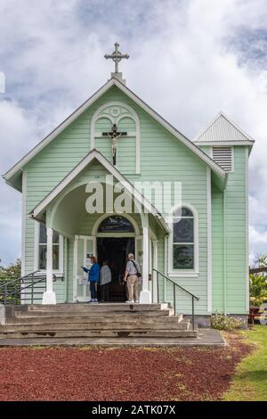 Kalapana, Hawaii, USA. - January 14, 2020: Mary, Star of the Sea Catholic Church. Portrait of entrance under white cloudscape shows pale green painted Stock Photo