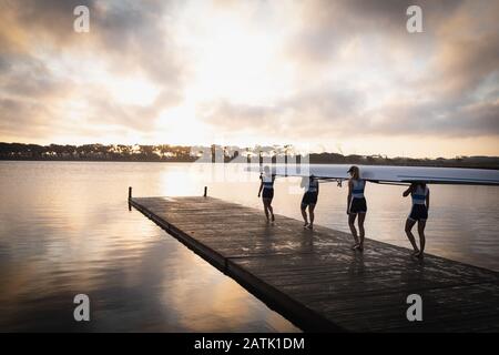 Female rowing team training on a river Stock Photo