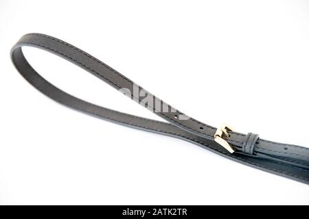 Black leather fastening belt, strap isolated on white background - Image Stock Photo