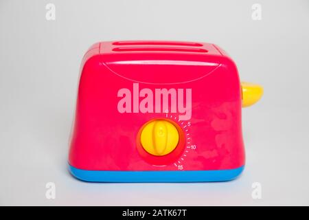 Childs toy plastic food toaster - Image Stock Photo