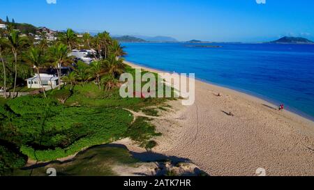 Aerial view down onto idyllic wide, sandy Lanikai Beach with calm turquoise waters rippling up on shore, Kailua, Oahu Island, Hawaii, USA Stock Photo