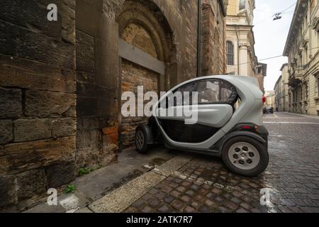 A Renault Twizy two-seat electric city car - quadricycle  parked in the historic centre of Parma, Italy Stock Photo