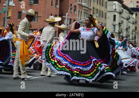 Participants are seen dancing during the annual Cinco de Mayo Parade in New York City on May 06, 2018. Stock Photo