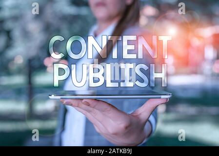 Conceptual hand writing showing Content Publish. Concept meaning prepares and issues or delivers content to an audience Outdoor scene with business wo Stock Photo