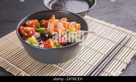 Fried rice with vegetables, beans and shrimp. Asian food. Copy space Stock Photo