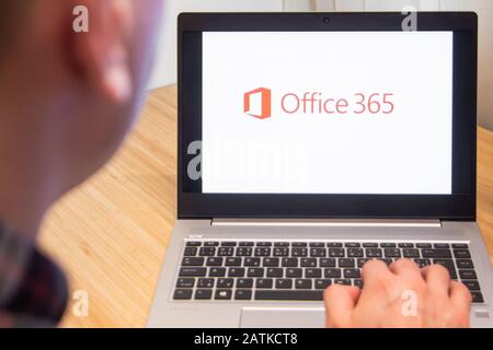 Office 365 is used by a man on the laptop. Microsoft customer used computer software. New product is tested by IT specialist. San Francisco, February Stock Photo