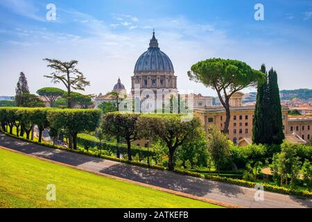 Rome, Vatican City / Italy - 2019/06/15: Panoramic view of St. Peter’s Basilica - Basilica di San Pietro in Vaticano - dome by Michelangelo Buonarotti Stock Photo
