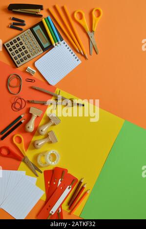 School supplies on colorful paperboard Stock Photo