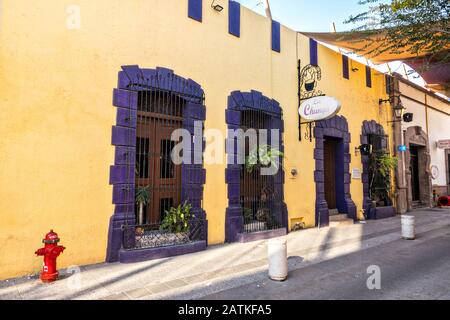 Colorful Spanish Colonial style buildings and cobblestone streets in the Barrio Antiguo or Spanish Quarter neighborhood adjacent to the Macroplaza Grand Plaza in Monterrey, Nuevo Leon, Mexico. Stock Photo