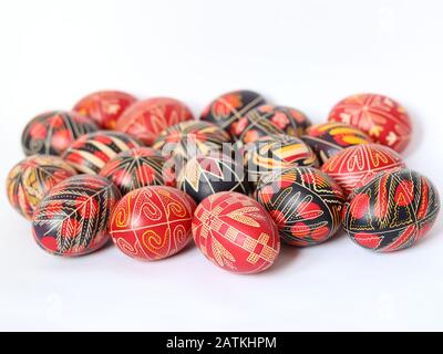 Group of romanian traditional painted, decorated Easter Eggs isolated on white background, handmade, traditional symbols, Eastern Europe, text space Stock Photo