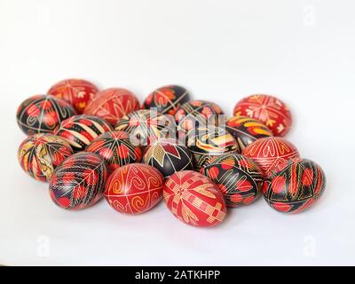 Group of romanian traditional painted, decorated Easter Eggs isolated on white background, handmade, traditional symbols, Eastern Europe, text space Stock Photo