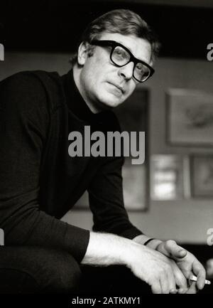 Portrait of Michael Caine smoking a cigarette, 1966. Cinema Legacy Collection  File Reference # 33962-164THA Stock Photo