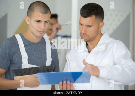 portrait of a painter with apprentice Stock Photo