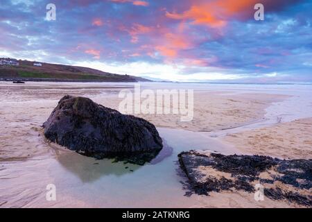 Vibrant sunset on the golden sand at Porthmeor Beach St Ives Cornwall England UK Europe Stock Photo