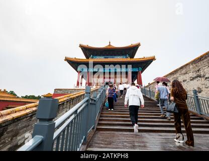 Tourists walking up steps to wall, Gate of Divine Prowess, Forbidden City, Beijing, China, Asia Stock Photo