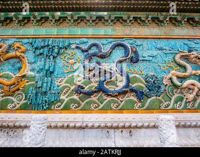 Colourful bas-relief nine dragon frieze or screen (Ningshougong), Palace of Tranquil Longevity, Inner Court, Forbidden City, Beijing, China Stock Photo