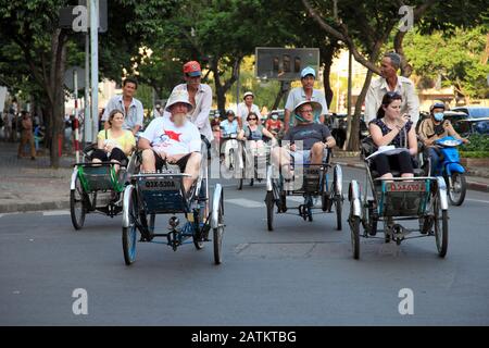 Tourists Riding Cycle Rickshaws, Le Loi Boulevard, Ho Chi Minh City, Saigon, Vietnam, Southeast Asia, Asia Stock Photo