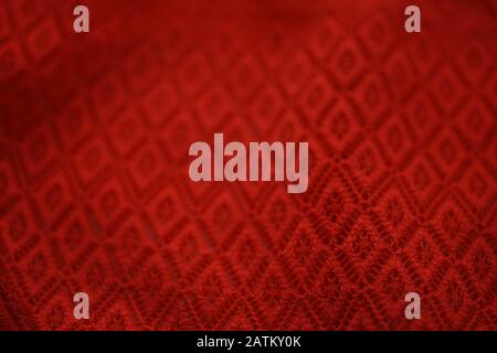 Red texture canvas fabric as a background. Stock Photo