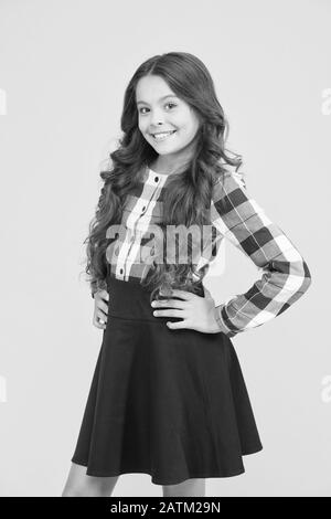 Small smiling child curly hairdo. Perfect curly hairstyle. Different shaped curling wands do to your hair. Curve soft curl tong. From tightly defined ringlets to loose beachy waves. Curly and happy. Stock Photo