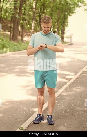 Sports Watch Man Making Sport Outdoor Sportswear Fashion Health And Fitness Sportsman Full Of Energy Sportsman Practising Sport Activities Tracking Training With Sports Watch Fitness Bracelet Stock Photo Alamy