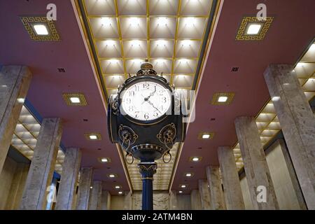 TORONTO - FEBRUARY 2020:  Large ornate clock in art deco style banking hall, head office of Scotiabank. Stock Photo